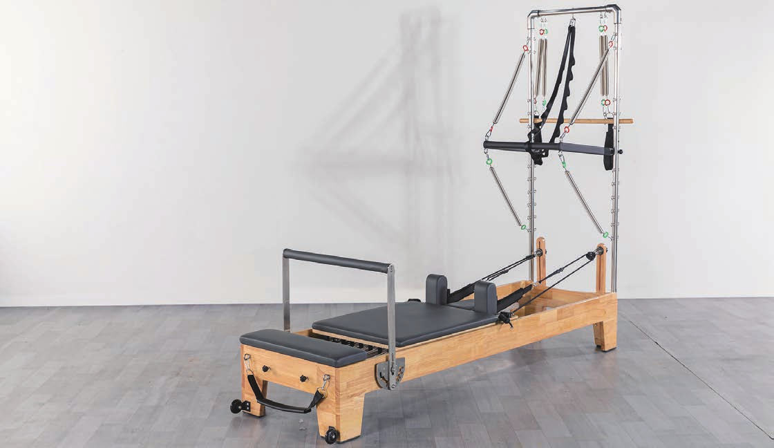 Solid oak Pilates reformer from the Rèforme Signature Collection